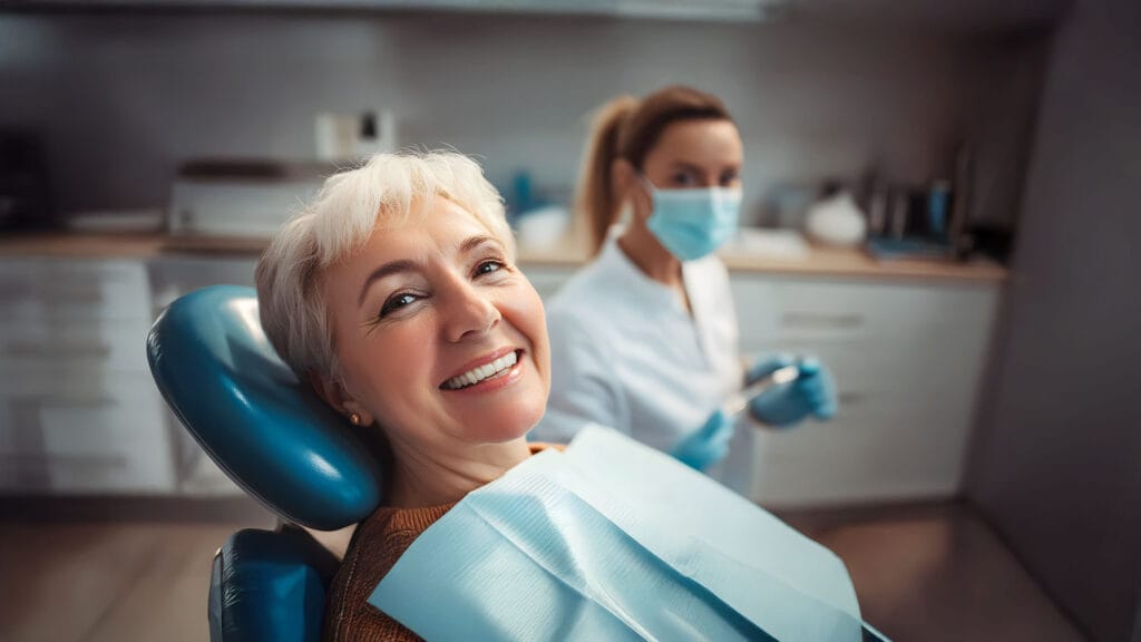 Close-up of a smiling woman with bright white teeth, showcasing the results of cosmetic dentistry.